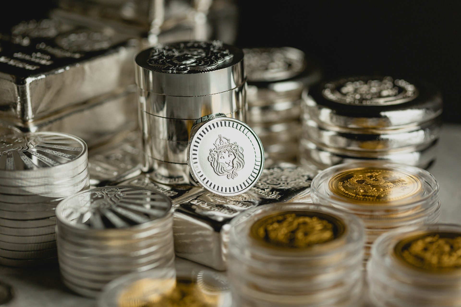 a table topped with lots of silver and gold coins